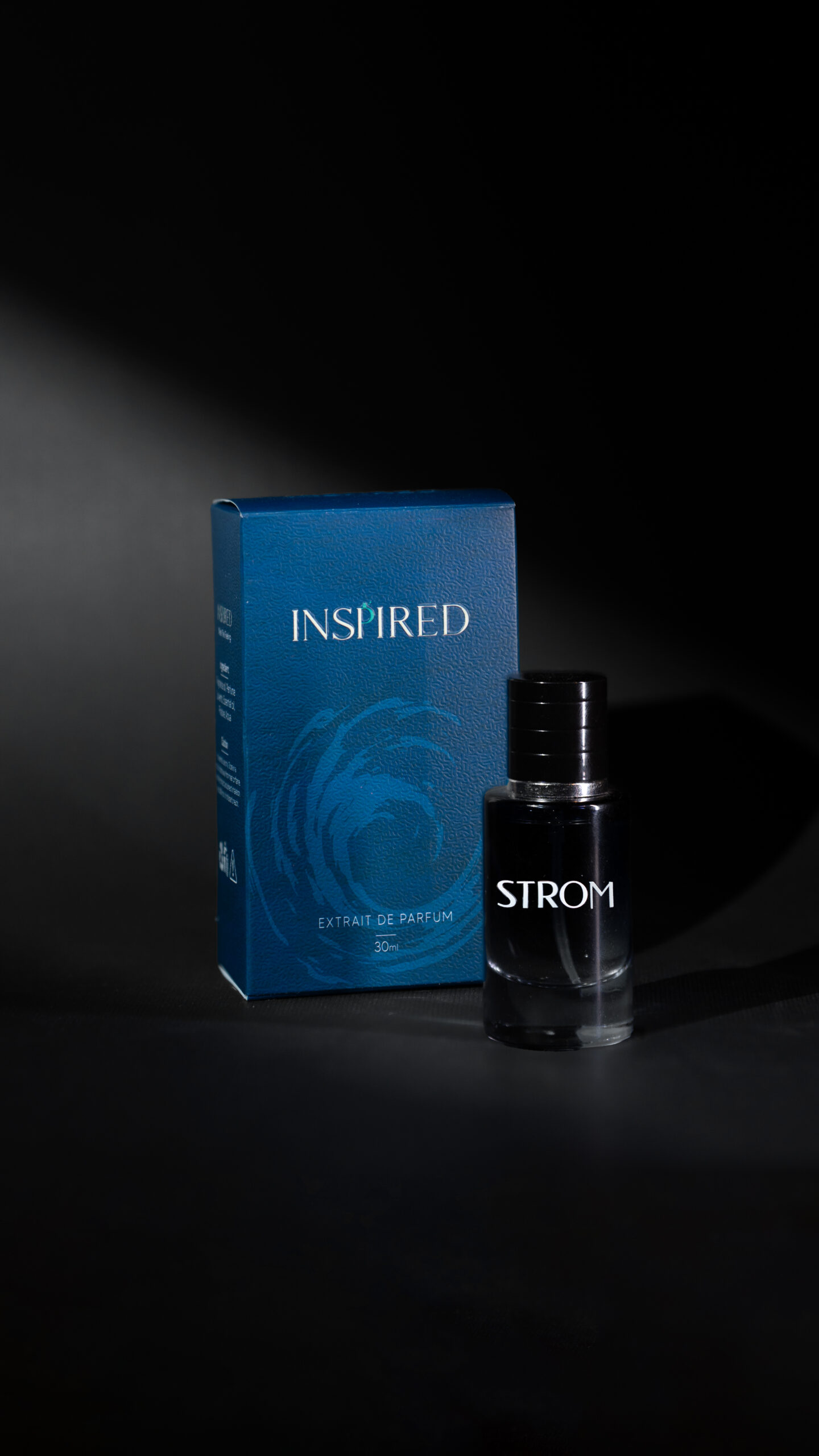 Bottle of Inspired Storm men’s fragrance, sleek dark design, inspired by Dior Sauvage.
