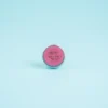 Close-up of Solid Perfume Charm tin highlighting eco‑friendly design and feminine fragrance.