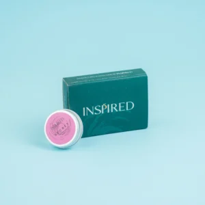 Solid Perfume Secret displayed elegantly, inspired by Bombshell with fresh fruity floral notes.