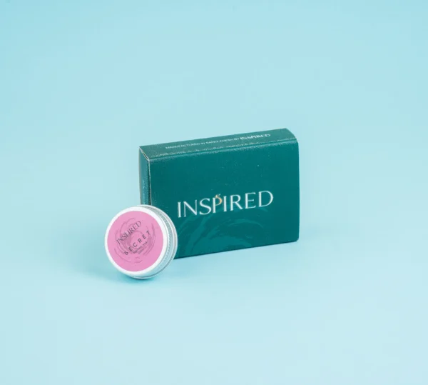 Solid Perfume Secret displayed elegantly, inspired by Bombshell with fresh fruity floral notes.